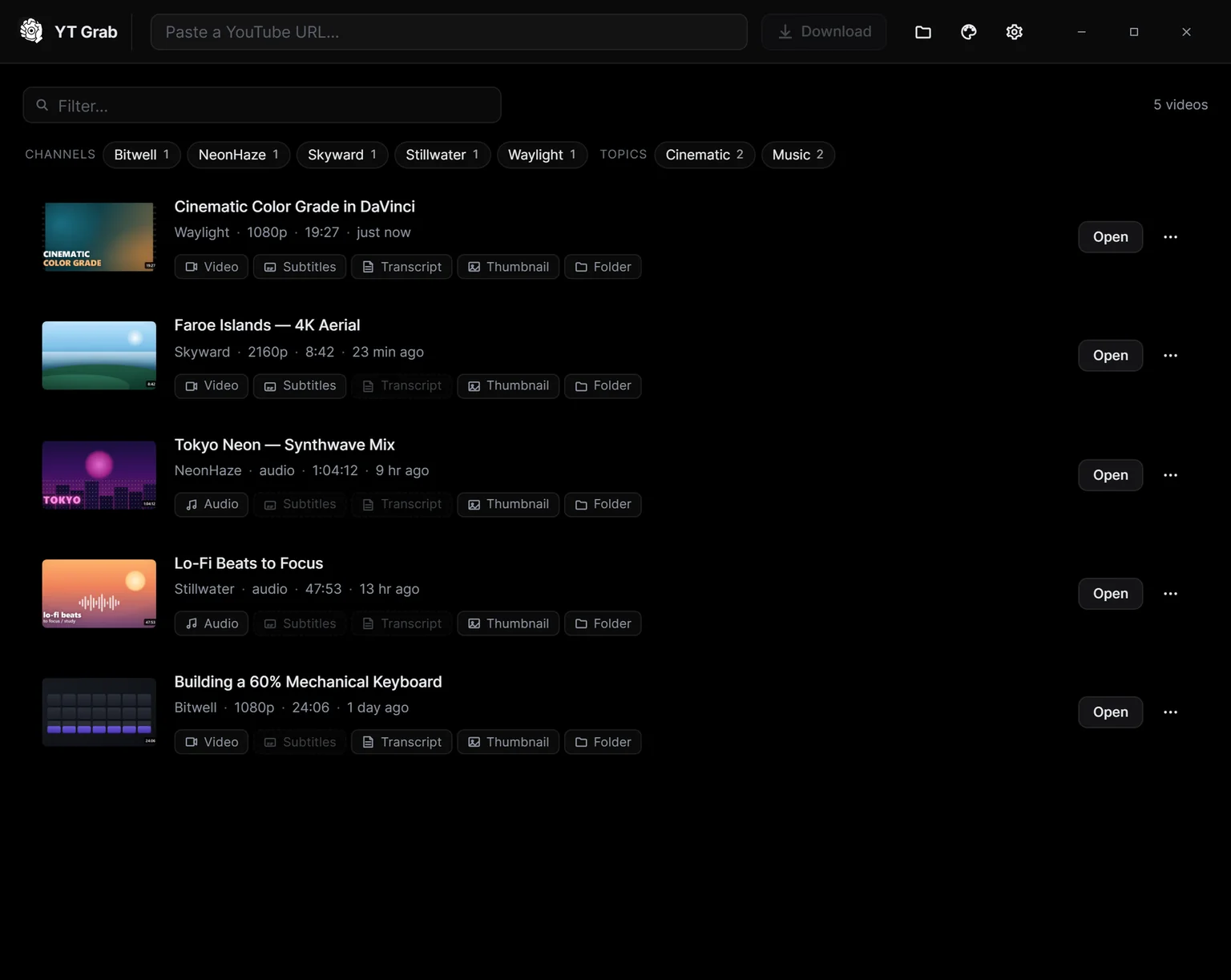 YT Grab's main window with the library auto-grouped by channel and topic